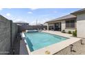 Backyard featuring a pristine pool and spa, complemented by an inviting outdoor patio at 22657 N 184Th Ln, Surprise, AZ 85387