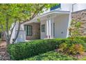 Beautiful home exterior featuring a covered porch, stone accents, and lush landscaping at 3718 E Sells Dr, Phoenix, AZ 85018