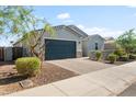 Inviting exterior view showcasing a well-maintained lawn, mature landscaping, and a paved driveway at 4143 E Sidesaddle Rd, San Tan Valley, AZ 85140
