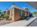 A lovely desert home featuring neutral color scheme, low maintenance landscaping and sidewalk at 854 S San Marcos Bldg 6 -- # A, Apache Junction, AZ 85120