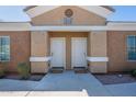 Condo featuring dual front doors, unit identifiers, and desert landscaping offering appealing curb appeal at 854 S San Marcos Bldg 6 -- # A, Apache Junction, AZ 85120