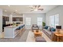 Modern living room and kitchen, with plush seating, island countertop, and lots of natural light at 854 S San Marcos Dr Bldg 6 Dr # D, Apache Junction, AZ 85120