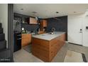 Modern kitchen featuring custom wood cabinets, stainless steel appliances, and sleek countertops at 1111 W University Dr # 1017, Tempe, AZ 85281