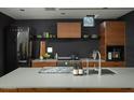 Well-equipped kitchen with a large island, custom cabinetry, and modern appliances at 1111 W University Dr # 1017, Tempe, AZ 85281