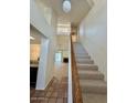 Inviting entryway featuring a staircase and views into the home's living spaces at 14002 N 49Th Ave # 1021, Glendale, AZ 85306