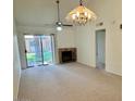 Inviting living room with natural light, fireplace, and access to the outdoor area at 14002 N 49Th Ave # 1021, Glendale, AZ 85306