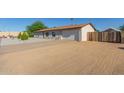 View of front exterior with desert landscaping and an attached garage, freshly painted at 3433 E Betty Elyse Ln, Phoenix, AZ 85032