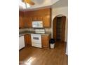 Spacious kitchen features wooden cabinets and modern appliances with laminate flooring at 6223 N 12Th St # 1, Phoenix, AZ 85014