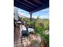 Charming balcony with outdoor dining set, showcasing beautiful views and relaxing space at 100 N Lazy Fox Rd # 8, Wickenburg, AZ 85390