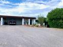 Spacious property featuring desert landscaping and a covered parking area for multiple vehicles at 100 N Lazy Fox Rd # 8, Wickenburg, AZ 85390