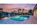 Gorgeous backyard pool with views of the lake and palm trees at 16239 S 18Th Pl, Phoenix, AZ 85048