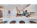 Spacious kitchen featuring a breakfast bar with seating and ample counter space at 16762 W Alameda Rd, Surprise, AZ 85387