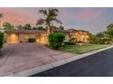 Beautiful home with well-manicured lawn, mature palm trees, desert landscaping and a spacious driveway at 1758 E Carver Rd, Tempe, AZ 85284