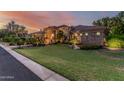Expansive front yard showcasing lush green grass, desert landscaping, and a charming single-story home at 1758 E Carver Rd, Tempe, AZ 85284