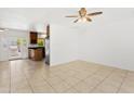 Open living room with tiled floors, neutral paint, and natural light from the patio doors at 2745 E Dahlia Dr, Phoenix, AZ 85032