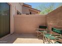 Private courtyard with two chairs and a view of the sky at 42424 N Gavilan Peak Pkwy # 57104, Anthem, AZ 85086