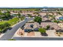 This aerial view showcases the property's tile roof, three-car garage, and mature landscaping at 5529 E Holmes Ave, Mesa, AZ 85206