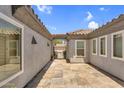 View of private courtyard featuring a tile walkway and entry to the main house at 5529 E Holmes Ave, Mesa, AZ 85206