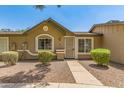 Charming single-story home with desert landscaping and a cozy, covered entrance at 6711 W Osborn Rd # 82, Phoenix, AZ 85033