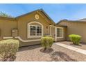 Quaint single-story home with desert landscaping and a welcoming, covered entrance at 6711 W Osborn Rd # 82, Phoenix, AZ 85033