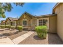 Attractive single-story home with desert landscaping and a charming covered entryway at 6711 W Osborn Rd # 82, Phoenix, AZ 85033