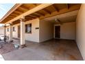 A covered carport featuring two support columns, painted ceilings and convenient access to the front door at 1545 W 7Th Ave, Mesa, AZ 85202