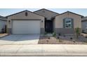 Charming single-Gathering home with a well-maintained front yard, a two-car garage, and a welcoming entrance at 3781 N Camden Dr, Florence, AZ 85132