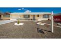 Inviting single-story home with desert landscaping, walkway, and covered porch at 509 N 56 St, Mesa, AZ 85205