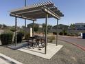 Community pergola providing shade and seating for outdoor gatherings and neighborhood picnics at 2339 E University Dr # 19, Mesa, AZ 85213