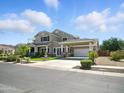 Beautiful two-story home featuring a water fountain and a covered parking area at 2822 E Constance Way, Phoenix, AZ 85042