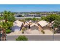 Aerial view of desert neighborhood homes, with solar panels and desert landscaping at 316 W Kelton Ln, Phoenix, AZ 85023