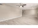 Bright living room with recessed lighting, tile floors, neutral paint, and large window at 3209 N 20Th Pl, Phoenix, AZ 85016