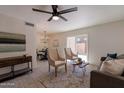 Bright living room featuring modern decor, stylish furnishings, and sliding glass doors for a seamless indoor-outdoor experience at 4268 N 68Th Ave, Phoenix, AZ 85033