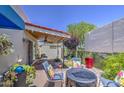 Cozy outdoor patio with comfortable seating, potted plants, and covered area for relaxation and entertainment at 5335 N 78Th St, Scottsdale, AZ 85250