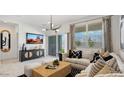 Bright living room with large windows, comfortable seating, and modern decor at 5550 E Mearn Rd, San Tan Valley, AZ 85140