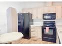 Classic kitchen with black appliances, ample cabinetry and countertop space, and easy access to dining at 5735 E Mcdowell Rd # 436, Mesa, AZ 85215