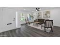 Inviting living room with wood floors, neutral walls, stylish decor, and natural light at 8329 E Keim Dr, Scottsdale, AZ 85250