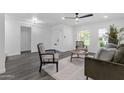 Bright living room with modern decor, stylish seating, and wood floors at 8329 E Keim Dr, Scottsdale, AZ 85250