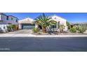 Beautiful single-story home features desert landscaping, stucco walls, and a green garage door at 14304 W Coronado Rd, Goodyear, AZ 85395