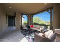 Inviting covered porch with comfortable seating and stylish decor at 20702 W Hillcrest Blvd, Buckeye, AZ 85396