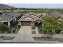 Beautiful single-story home with three-car garage and covered porch at 20702 W Hillcrest Blvd, Buckeye, AZ 85396