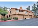 Attractive multi-level townhome with a two-car garage and well-maintained landscaping at 5640 E Bell Rd # 1099, Scottsdale, AZ 85254