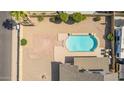 Aerial view of a private backyard oasis with a sparkling pool and patio area at 7709 W Hearn Rd, Peoria, AZ 85381
