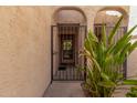 A secure gated entrance through an archway leads to the front door at 8540 N Central Ave # 6, Phoenix, AZ 85020