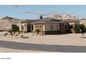 Stunning home with desert landscaping and stone accents on the front elevation at 30660 N 120Th Ln, Peoria, AZ 85383