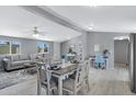 Inviting space showing the living room, dining area, a desk and an office space, all with neutral tones and ample light at 320 E Mckellips Rd # 34, Mesa, AZ 85201