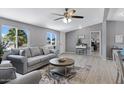 Bright living room boasts neutral colors, comfortable seating, view of a window and open access to adjacent rooms at 320 E Mckellips Rd # 34, Mesa, AZ 85201