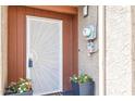 Up close shot of front door with potted plants and security door at 7756 N 19Th Ln, Phoenix, AZ 85021