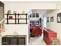 Comfortable living room with bookshelves and a red sofa at 7756 N 19Th Ln, Phoenix, AZ 85021