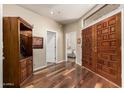 Inviting entryway with wood floors, double doors, and views into the home at 7955 E Chaparral Rd # 17, Scottsdale, AZ 85250